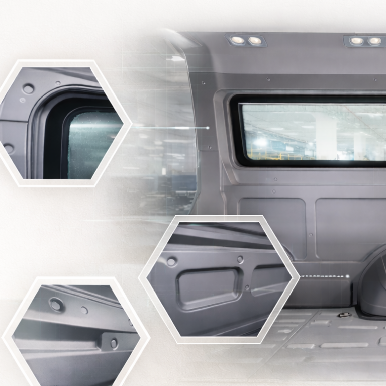 A grey door with a window, featuring multiple hexagonal sections.